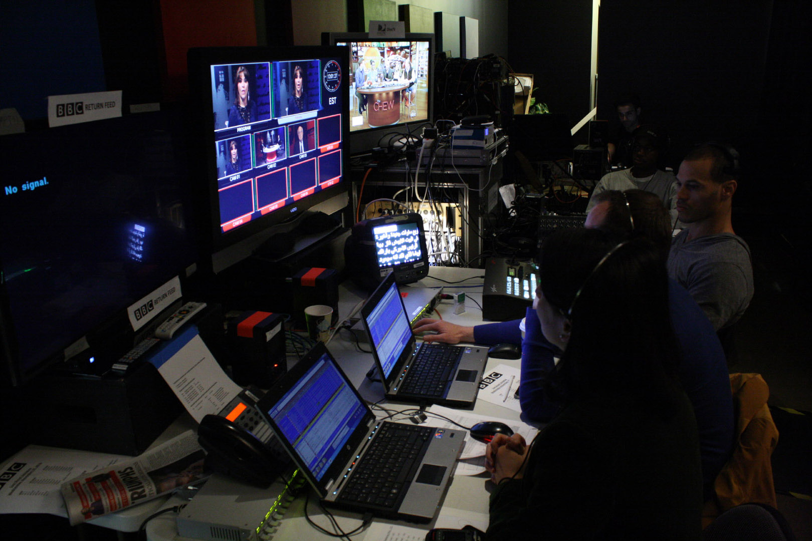 IMG control-room team operating broadcast equipment and monitors